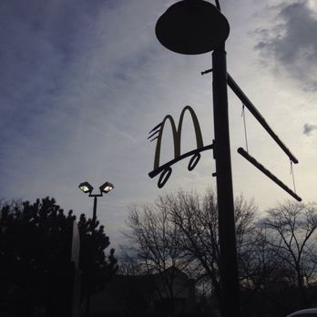 McDonald's - a street light and a mcdonald's logo - Burgers Near Me - Chicago, Illinois McDonald's - a street light and a mcdonald's logo - Burgers Near Me - Chicago, Illinois