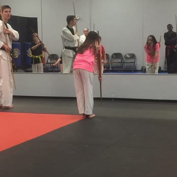 Mountain Kim Martial Arts - Daughter doing bow staff form - Martial Arts Near Me - Fredericksburg, Virginia Mountain Kim Martial Arts - Daughter doing bow staff form - Martial Arts Near Me - Fredericksburg, Virginia