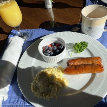 Ocean House - Scrambled egg and sausages.  There is fruit every day! - Hotels Near Me - Newport, Oregon