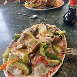 Two Lunch Specials one with White garlic sauce and one with spicy  sauce