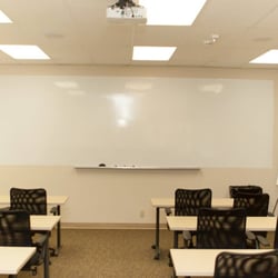 Centerco Office Suites - The large conference room seats up to 20 individuals. It includes a white board and projector connections