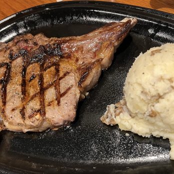 Outback Steakhouse - Bone-In Ribeye* 18 oz. With Homestyle Mashed Potatoes - Steakhouses Near Me - Bayside, New York Outback Steakhouse - Bone-In Ribeye* 18 oz. With Homestyle Mashed Potatoes - Steakhouses Near Me - Bayside, New York