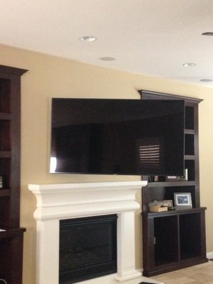 TVs Mounted on a Fireplace - Just Hang can mount TV on fireplaces, and also hide your wires. We can even add a power outlet. TVs Mounted on a Fireplace - Just Hang can mount TV on fireplaces, and also hide your wires. We can even add a power outlet.
