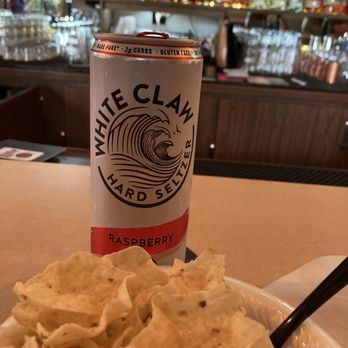 Day Drink Inn - a bowl of chips and a can of white claw raspberry - Beer Bar Near Me - Milwaukee, Wisconsin