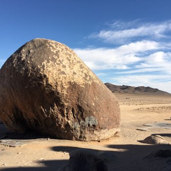 Giant Rock - See the truck on the right side. It's so little compared to the rock! - Local Flavor Near Me