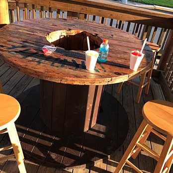 G's Freeze - a table and chairs on a deck - Shaved Ice Near Me - Pasadena, Texas G's Freeze - a table and chairs on a deck - Shaved Ice Near Me - Pasadena, Texas