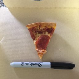 Pen for scale on a slice of 'small' pizza