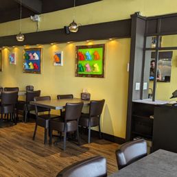 a restaurant with tables and chairs