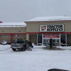 Tractor Supply - The front of the store And the guy that parked in the no parking space because it was cold out Enough said