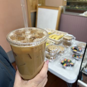Bagels Bagels Bagels - a person holding a cup of iced coffee - Bagels Near Me - Franklin Square, New York Bagels Bagels Bagels - a person holding a cup of iced coffee - Bagels Near Me - Franklin Square, New York