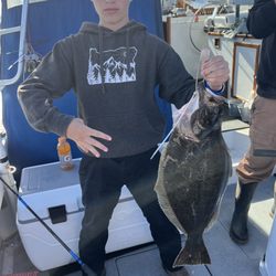 Lucky Six Sportsfishing - My son Sam his first Halibut