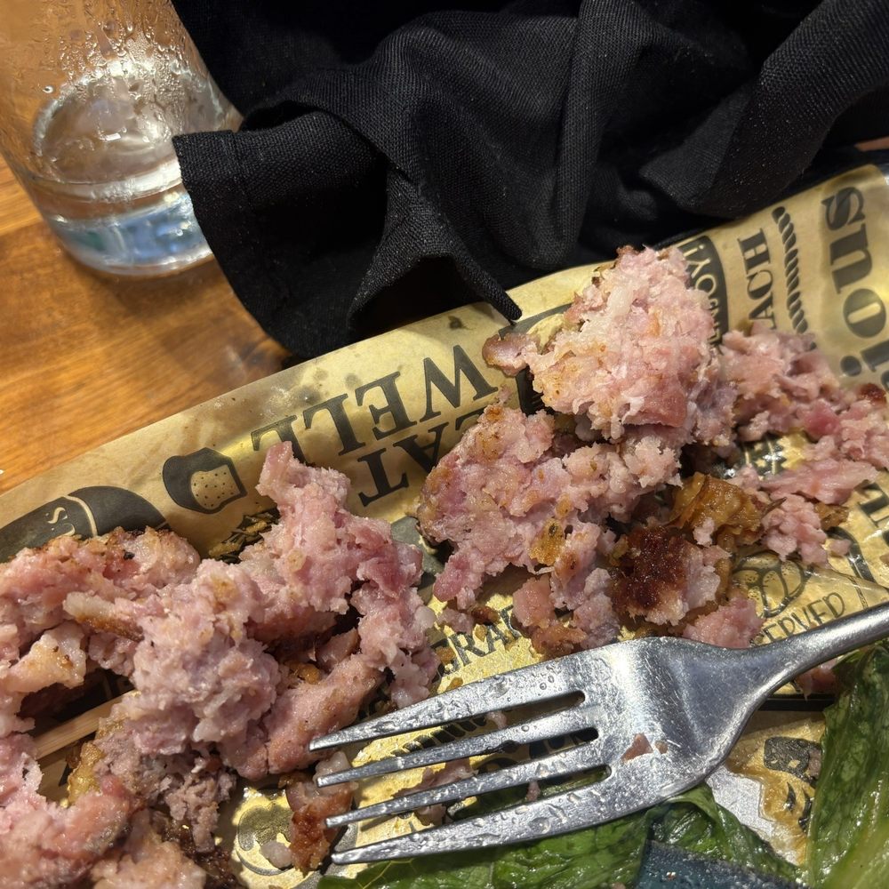 Raw and fatty layer of bacon on the burger patty Raw and fatty layer of bacon on the burger patty