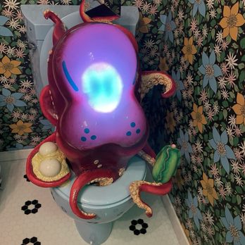 The Real Unreal - Meow Wolf - Octopus on toilet in the house - Art Museums Near Me - Grapevine, Texas The Real Unreal - Meow Wolf - Octopus on toilet in the house - Art Museums Near Me - Grapevine, Texas