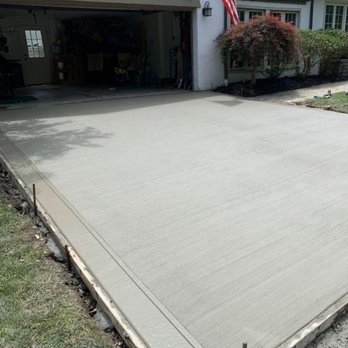 A&P Singh Construction - a concrete driveway being poured - General Contractors Near Me