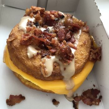 Duck Donuts - Bacon, egg, and cheese on a donut with bacon and maple drizzle. - Donuts Near Me - Cary, North Carolina Duck Donuts - Bacon, egg, and cheese on a donut with bacon and maple drizzle. - Donuts Near Me - Cary, North Carolina