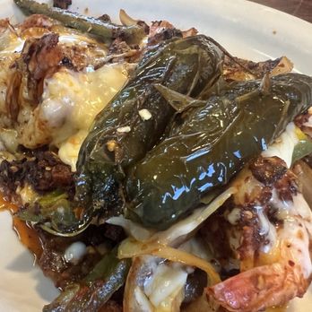 El Bracero - Paper thin, tough ribeye, plate is mostly onions with peppers - Mexican Near Me - Amarillo, Texas