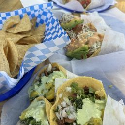 Tacos Al pastor, taco camarón, Baja taco and chips and queso Tacos Al pastor, taco camarón, Baja taco and chips and queso