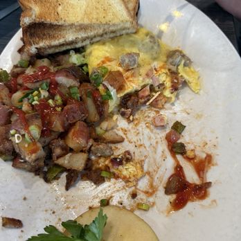 Hot Off The Griddle - Meat lovers omelet half eaten - Breakfast & Brunch Near Me - Orangevale, California