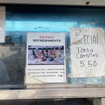 A Que Tacos - a sign in a window - Food Trucks Near Me - Bellingham, Washington A Que Tacos - a sign in a window - Food Trucks Near Me - Bellingham, Washington