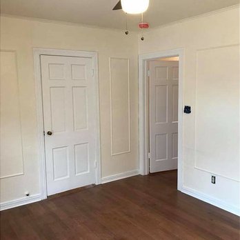 A1 Painting and Construction - an empty room with a ceiling fan - Painters Near Me A1 Painting and Construction - an empty room with a ceiling fan - Painters Near Me