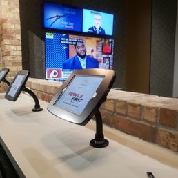 Bar seating with phone chargers and 3 TVs, and comfy modern seating that is couch height as well. Bar seating with phone chargers and 3 TVs, and comfy modern seating that is couch height as well.