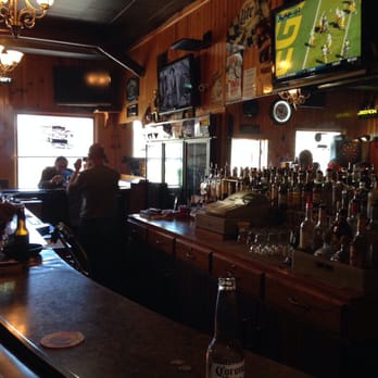Neighborhood Bar - people sitting at the bar watching a football game - Bars Near Me - Racine, Wisconsin Neighborhood Bar - people sitting at the bar watching a football game - Bars Near Me - Racine, Wisconsin