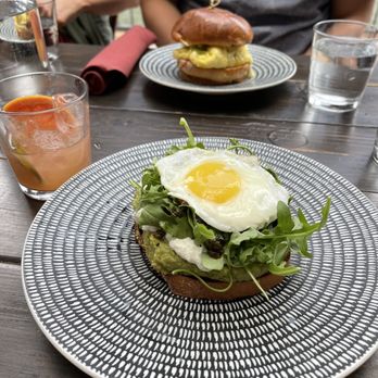 Beatnik On The River - Burrata avocado toast with an added fried egg - Cocktail Bars Near Me - Chicago, Illinois Beatnik On The River - Burrata avocado toast with an added fried egg - Cocktail Bars Near Me - Chicago, Illinois