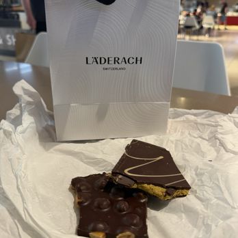 Läderach - FischSchoggi Dark Chocolate w/almond gianduja pistachio paste & roasted pistachio pieces & refined kataifi dough threads - Chocolatiers & Shops Near Me - Rosemont, Illinois Läderach - FischSchoggi Dark Chocolate w/almond gianduja pistachio paste & roasted pistachio pieces & refined kataifi dough threads - Chocolatiers & Shops Near Me - Rosemont, Illinois