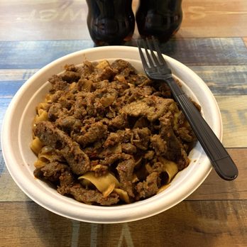 Handmade Dumplings and Noodles - With fork to show generous portion size - Noodles Near Me - Marietta, Georgia