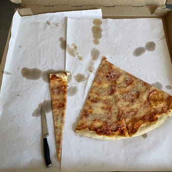 Jersey Giant Pizza - 28" pizza compared to a knife - Pizza Near Me - Bee Cave, Texas Jersey Giant Pizza - 28" pizza compared to a knife - Pizza Near Me - Bee Cave, Texas