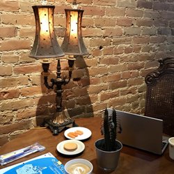 Anticafé - The brick wall and old lamp made the place more charming.