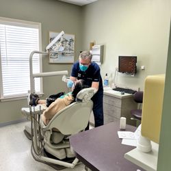 Pettey Dental of Bartlett - Dr. David Pettey working on dentures patient at Pettey Dental of Bartlett