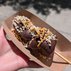 The Chocolate Dippery - chocolate dipped strawberry kabob with almonds and pretzels