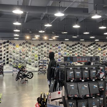 Cycle Gear - Wall full of helmets and there are more on stands. - Tires Near Me - Palm Desert, California
