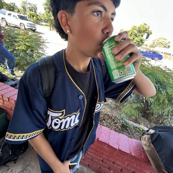 Alta Dena Dairy - a young boy drinking a drink - Convenience Stores Near Me - San Bernardino, California