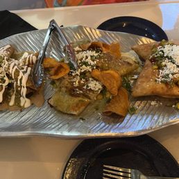 Shredded beef flautas, lobster taco and duck empanadas Shredded beef flautas, lobster taco and duck empanadas