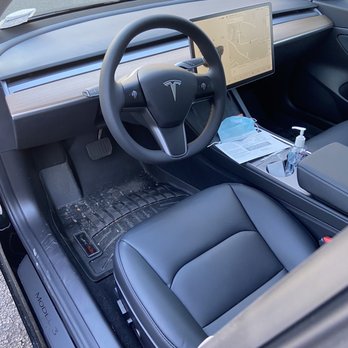 Tesla Smithtown - Santa brought him upgraded floor mats - Car Dealers Near Me - Nesconset, New York