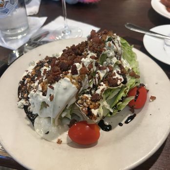 Old Stone Steakhouse - The "Classic" Wedge Salad. Avalanche of dressing down one side. - Steakhouses Near Me - Belmont, North Carolina Old Stone Steakhouse - The "Classic" Wedge Salad. Avalanche of dressing down one side. - Steakhouses Near Me - Belmont, North Carolina