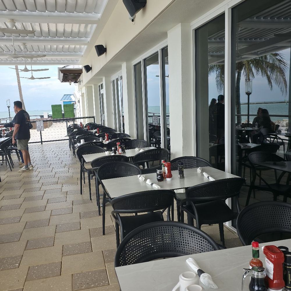 Cove Kitchen + Bar - Outside dinning area - Salad Near Me - Clearwater Beach, Florida Cove Kitchen + Bar - Outside dinning area - Salad Near Me - Clearwater Beach, Florida