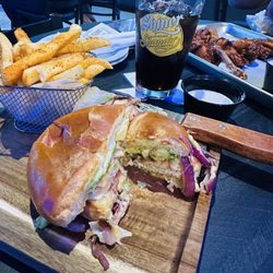 Grilled chicken sandwich with sauteed onions, swiss cheese and avacodo