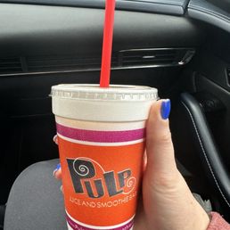 a hand holding a cup a hand holding a cup