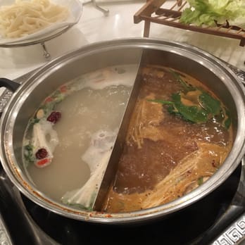 IPOT - Left side: Chinese Herbal Right side: Spicy Miso  Best combo - Hot Pot Near Me - San Francisco, California