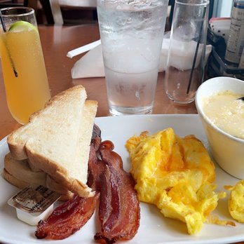 Another Broken Egg Cafe - Apple pie mimosa, Traditional Day Starter Breakfast with cheese added to grits - Breakfast & Brunch Near Me - Charlotte, North Carolina Another Broken Egg Cafe - Apple pie mimosa, Traditional Day Starter Breakfast with cheese added to grits - Breakfast & Brunch Near Me - Charlotte, North Carolina