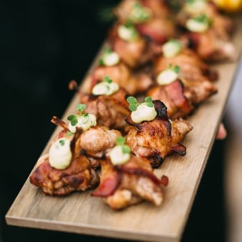 Primizie Catering - Bacon-wrapped quail appetizers (photo by Kat Bevel) - Caterers Near Me - Austin, Texas Primizie Catering - Bacon-wrapped quail appetizers (photo by Kat Bevel) - Caterers Near Me - Austin, Texas