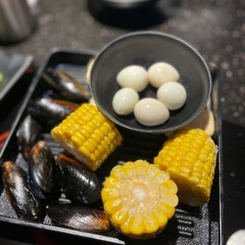 Hancook - a plate of steamed corn and boiled eggs - Korean Near Me - Oakland, California Hancook - a plate of steamed corn and boiled eggs - Korean Near Me - Oakland, California