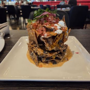 Guy Fieri's Flavortown Kitchen - Trash can nachos - Food Delivery Services Near Me Guy Fieri's Flavortown Kitchen - Trash can nachos - Food Delivery Services Near Me