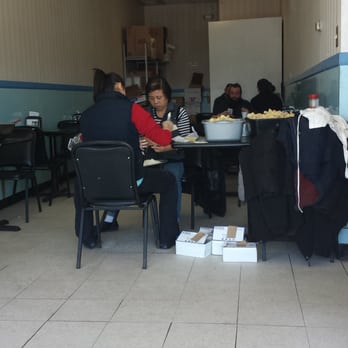 China Taste - Small dining area. Ladies preparing crab Rangoon. - Chinese Near Me - Gardner, Kansas