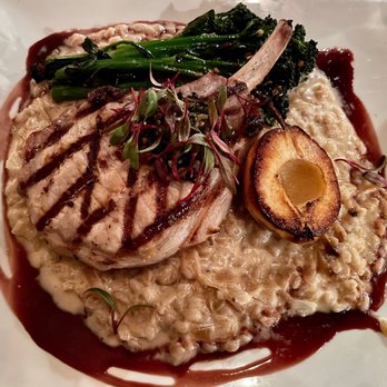 24 Carrot Bistro - Pork Chop with a beautiful reduction and pesto... - New American Near Me - Erie, Colorado 24 Carrot Bistro - Pork Chop with a beautiful reduction and pesto... - New American Near Me - Erie, Colorado