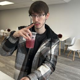 My brother holding mixed berry tea My brother holding mixed berry tea