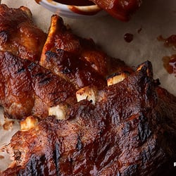 Logan's Famous Baby Back Ribs: Slow-roasted for eight hours before being slathered with a savory BBQ sauce.